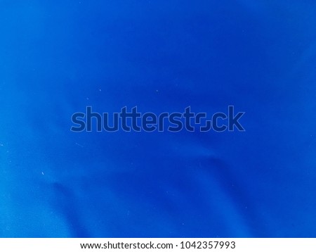 Bright blue plastic surface background
