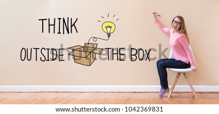 Think Outside The Box with young woman holding a pen in a chair