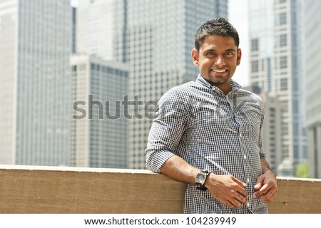 A happy young indian man from Malaysia.