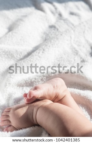 Baby foot on blanket background space