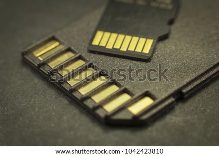 Memory cards to a computer close-up on a black background.