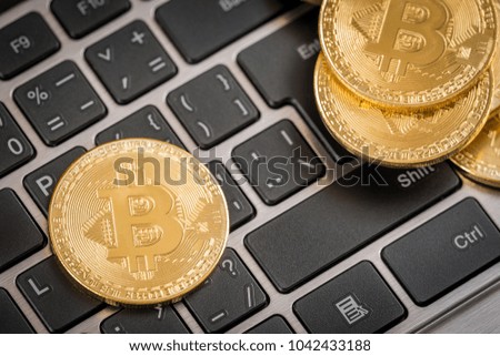 Gold coins crypto currency  bitcoin and keyboard
