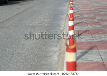 Road striped columns with shadows. Summer background 