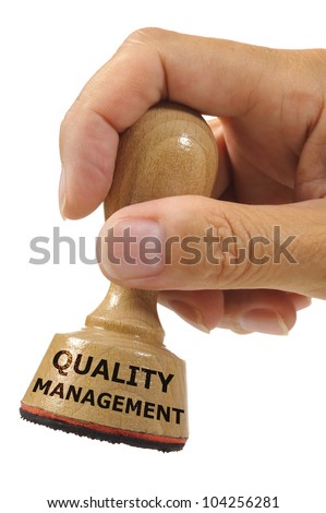 rubber stamp marked with quality management