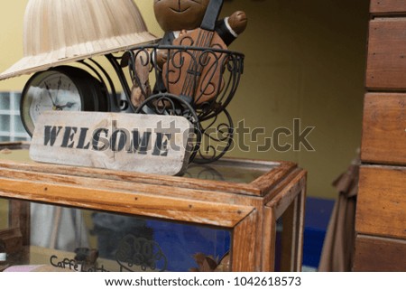 Welcome sign placed in front of a coffee shop