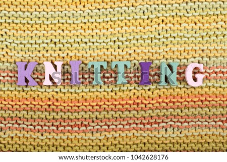 Knitting. Knitted Fabric Texture. Word composed from ABC alphabet letters