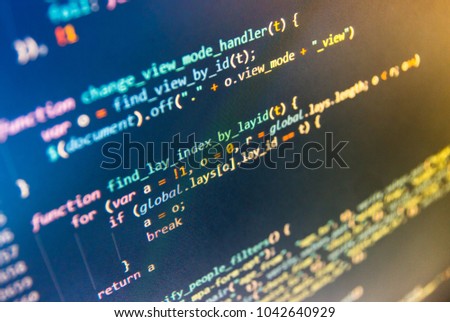 HTML website structure. Programmer typing new lines of HTML code. Script procedure creating. Mobile app building. Desktop PC monitor photo. Young business crew working with startup. 