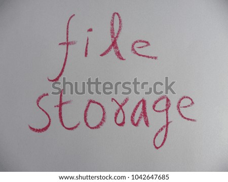 Text file storage hand written by crimson oil pastel on white color paper