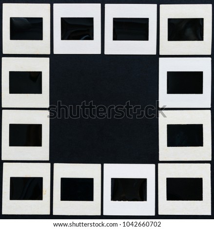 Vintage blank photo slides on black background with free space