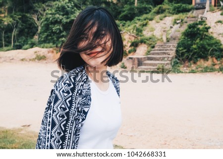 Portrait of beautiful asian women smiling on coast of sea outdoor