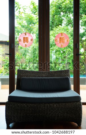 sofa and red chinese sign tear on glass door in waiting room decoration for chinese tea wedding ceremony,Translation: Double Happiness