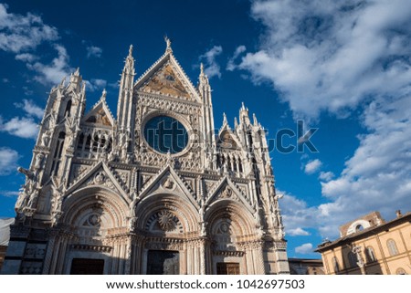 Historic buildings in SIena, Tuscany, Italy, at evening: exterior of the medieval cathedral (Duomo)