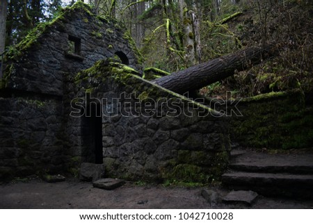 The Witch's Castle in Portland, Oregon is a spooky site of an old abandoned bathroom along a hiking path. Royalty-Free Stock Photo #1042710028