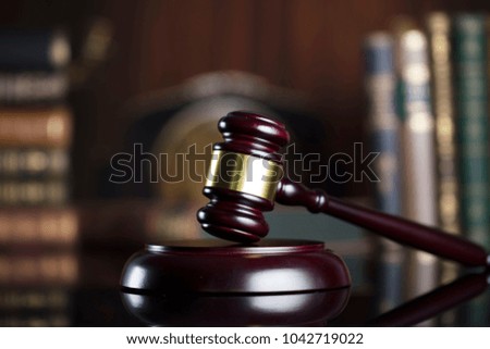 Law firm concept. Gavel, books, clock, balance, statue of justice.