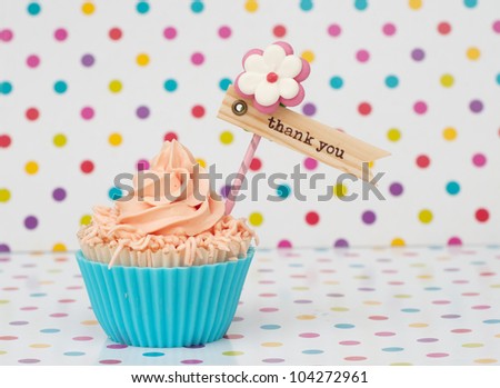 Blue pink cupcake with label on dotted background Royalty-Free Stock Photo #104272961