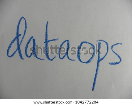 Text dataops hand written by blue oil pastel on white color paper