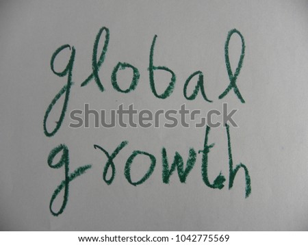 Text global growth hand written by green oil pastel on white color paper