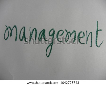 Text management hand written by green oil pastel on white color paper
