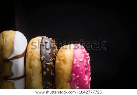 chocolate donuts on a dark background