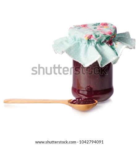 Raspberry jam in a jar wooden spoon on white background isolation