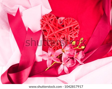red background, red heart and ribbon
