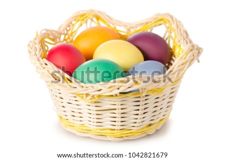 Easter color eggs in the basket on white background isolation