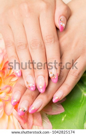 Manicure - a picture of a beautiful manicured woman's nail beauty treatment.