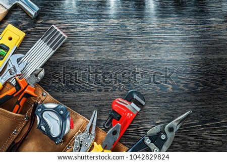 Claw hammer construction level adjustable spanner measuring tape Royalty-Free Stock Photo #1042829824