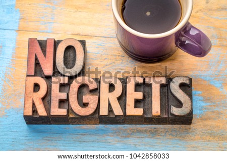 no regrets - word abstract in vintage letterpress printing blocks with a cup of coffee