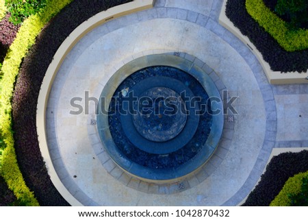 Aerial view of a round fountain. 