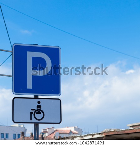 Parking sign for disabled people on a sky background