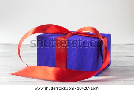 Gift boxes over wooden background close up