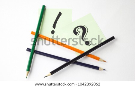 Pencils on white background with stickers and signs