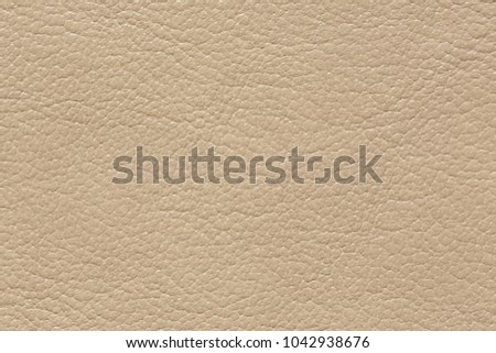 Beautiful leather texture in light beige colour. High resolution photo.