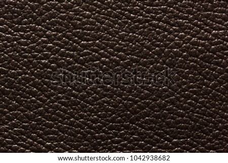 Exquisite dark leather texture with contrast surface. High resolution photo.