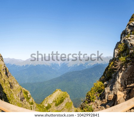 Image of scenic mountainous area against blue sky