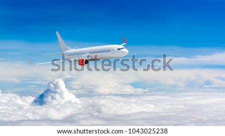 White airplane flying above cloud Royalty-Free Stock Photo #1043025238