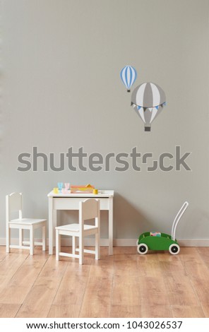 grey wall baby room small white table and chair toy room concept