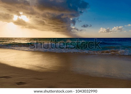 High waves of the Atlantic ocean on the beach of the Caribbean sea at sunset