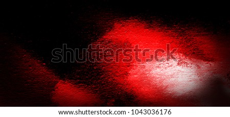 Fire and lava in darkness abstract art background. Oil painting on linen canvas. Black and red tones texture. Dimmed horizontal picture fragment. Brushstrokes of paint.