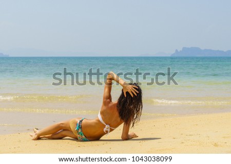 Cute woman relaxing on the summer beach