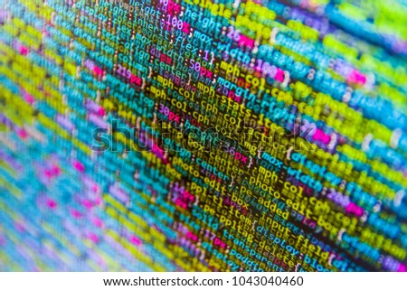 Programming of Internet website. IT specialist workplace. Programming code on computer screen. Digital binary data on computer screen. Desktop PC monitor photo. 