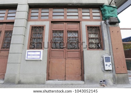 old wooden door and windows with curved steel
