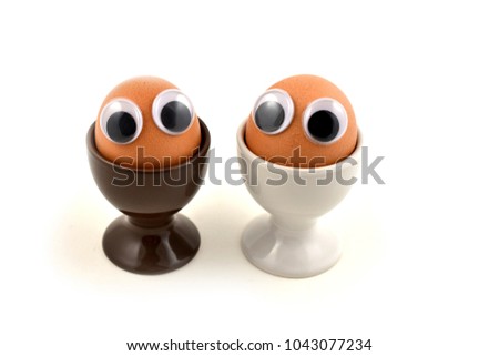 Cheerful egg character stock images. Funny Easter Egg. Easter egg with eyes. Easter eggs on a white background. Spring decoration images. Breakfast still life