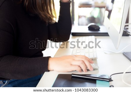 graphic designer use mouse and touchpad in photo work