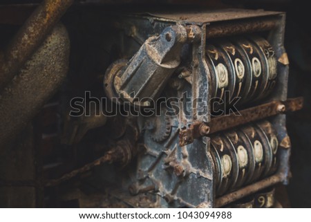 Oil , vintage rusty gasoline pump machine with brick wall background