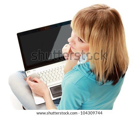 Back view of a woman holding a credit card and a laptop, isolated on white background