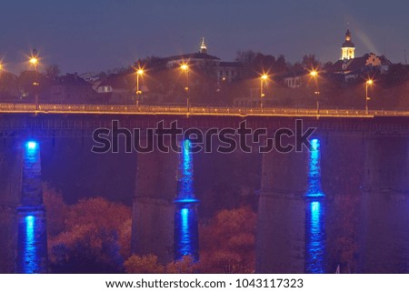 Night illumination of the ancient bridge in Kamyanets-Podolsky.