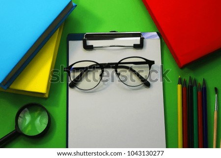 office workspace. flat view from above. folder holder, pencils, ruler, glasses. stationery. Desktop.