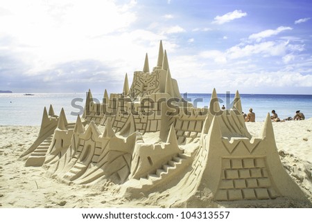 Sand castle on the picture perfect white sandy beach. Boracay, Philippines.